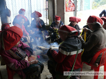 red dao women sewing
